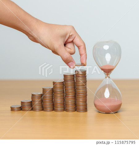 Money Saving for Future Plan, Retirement fund, Pension, Investment, Wealth Business and Financial concepts. hand putting coin on money stack with sandglass Money Saving for Future Plan, Retirement fund, Pension, Investment, Wealth Business and Financial concepts. hand putting coin on money stack with sandglass 115875795