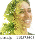 A cheerful leafy double exposure portrait of a young smiling woman 115878608