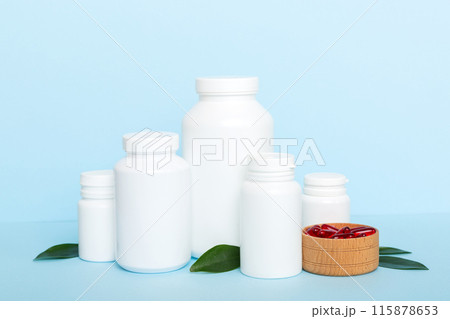 different drugs and health supplement pills with medicine bottle health care and medical top view. Vitamin tablets. Bottle with colored pills on table background. Multivitamins different drugs and health supplement pills with medicine bottle health care and medical top view. Vitamin tablets. Bottle with colored pills on table background. Multivitamins 115878653