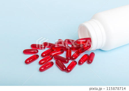 different drugs and health supplement pills poured from a medicine bottle health care and medical top view on colored background different drugs and health supplement pills poured from a medicine bottle health care and medical top view on colored background 115878714