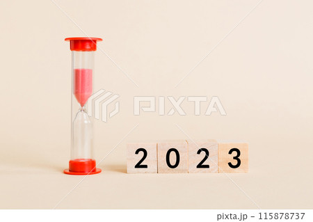 New Year 2023 sand timer. Resolution, time, plan, goal, motivation, reboot, countdown and New Year holiday concepts. Hourglass with number 2023 115878737