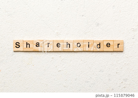 shareholder word written on wood block. shareholder text on table, concept 115879046