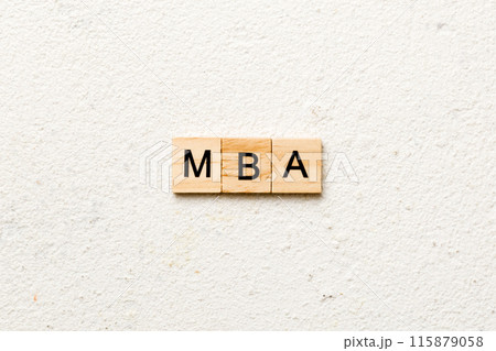MBA word written on wood block. Master of Business Administration text on table, concept 115879058