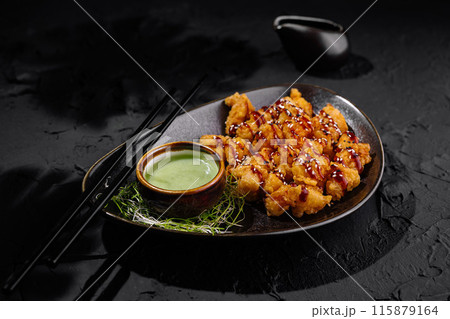 Crispy asian chicken with dipping sauces 115879164