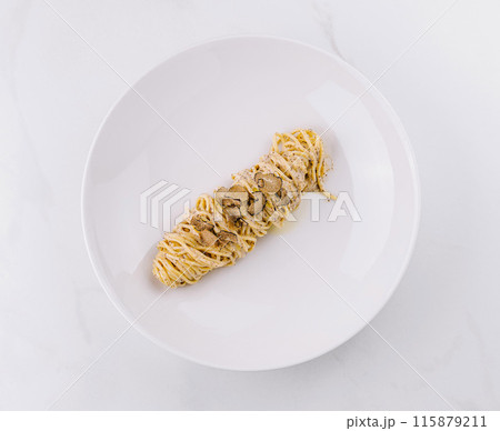Elegant truffle pasta on white plate Elegant truffle pasta on white plate 115879211