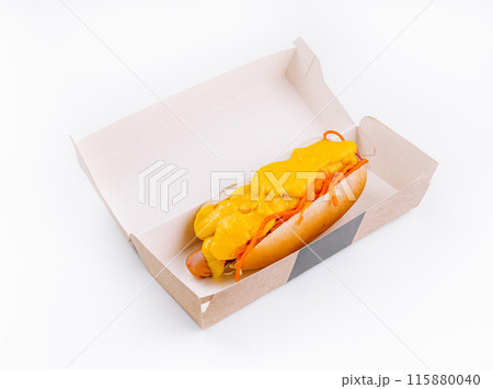 Cheesy hot dog in takeout box on white background Cheesy hot dog in takeout box on white background 115880040