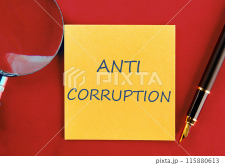 Anti money laundering business and government concept. ANTI CORRUPTION on a yellow sticker on a red background Anti money laundering business and government concept. ANTI CORRUPTION on a yellow sticker on a red background 115880613