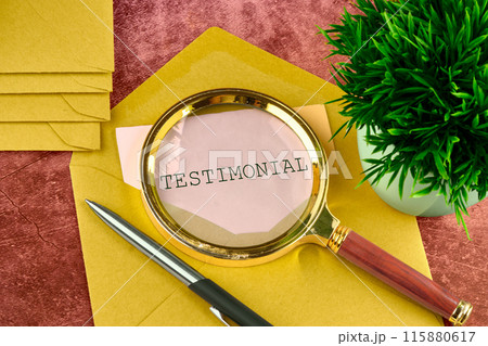 TESTIMONIAL written on a piece of paper sticking out of a mail envelope 115880617