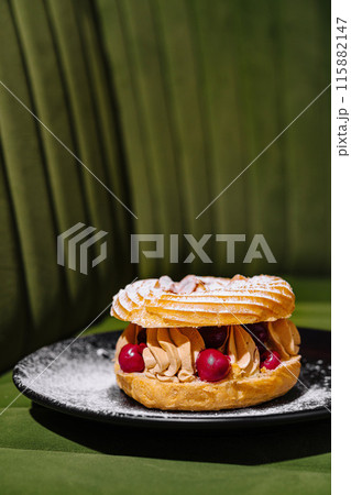 Gourmet paris-brest pastry on elegant plate Gourmet paris-brest pastry on elegant plate 115882147