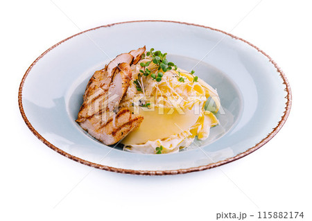 Elegant grilled chicken breast with cheese and cream sauce 115882174