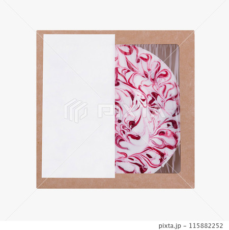 Pre-packaged cheesecake with cherry swirl design in a cardboard box, ready for sale Pre-packaged cheesecake with cherry swirl design in a cardboard box, ready for sale 115882252