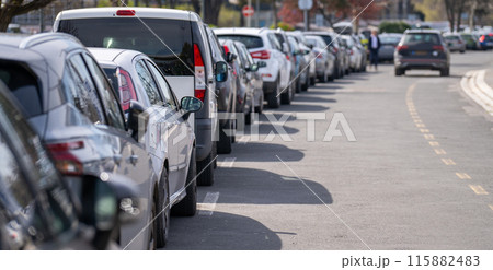 Cars in a row. A lot of parked vehicles Cars in a row. A lot of parked vehicles 115882483