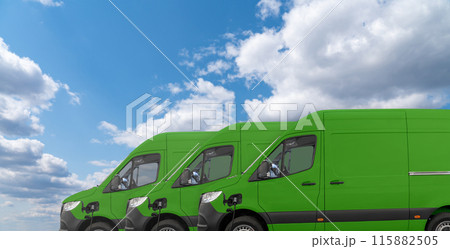 Green electric delivery vans with connected charging cables 115882505