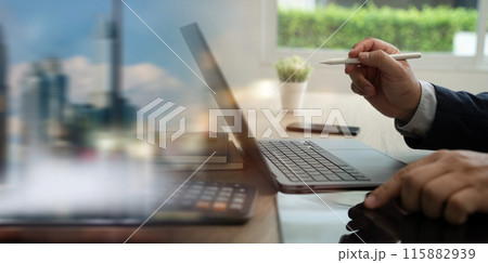 Business corporate finance analysis chart graph person using a laptop computer tablet analyzing data datum 115882939