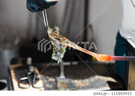 Sculpting flower of molten glass Sculpting flower of molten glass 115883415