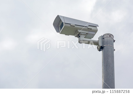 security camera is attached to a pole 115887258
