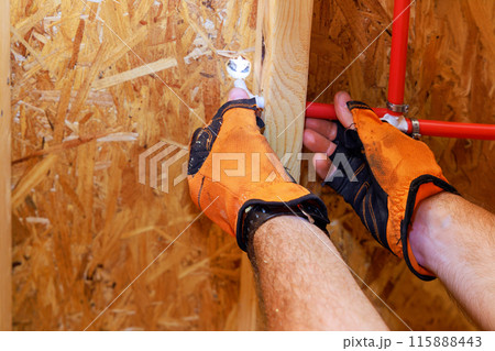 Installation connection of PVC plastic water pipes in home wall Installation connection of PVC plastic water pipes in home wall 115888443