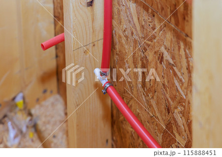 PVC plastic water lines are installed connected to house wall PVC plastic water lines are installed connected to house wall 115888451