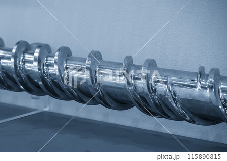 Close up scene the barrel screw of injection machine spare parts. Close up scene the barrel screw of injection machine spare parts. 115890815