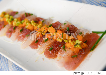 FISH CEVICHE RECIPE, SEA BREAM AND TUNA, AVOCADO, BELL PEPPER, CHILLI, CHIVES, LEMON, OLIVE OIL FISH CEVICHE RECIPE, SEA BREAM AND TUNA, AVOCADO, BELL PEPPER, CHILLI, CHIVES, LEMON, OLIVE OIL 115891616