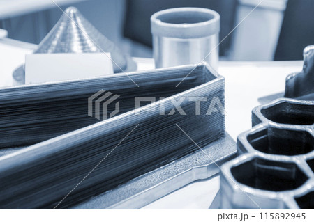 Object printed by 3D printer from metal. Additive manufacturing solution. Object created on 3Dprinter from melting metal thread. 3D Metal Printing. Metal additive manufacturing Object printed by 3D printer from metal. Additive manufacturing solution. Object created on 3Dprinter from melting metal thread. 3D Metal Printing. Metal additive manufacturing 115892945