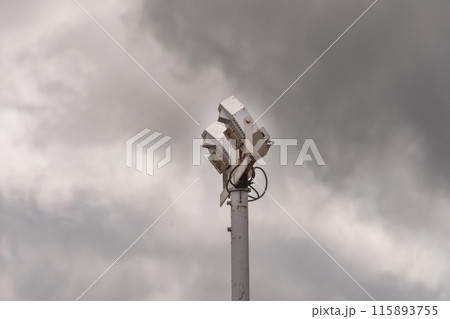 Large spotlight against a cloudy sky 115893755