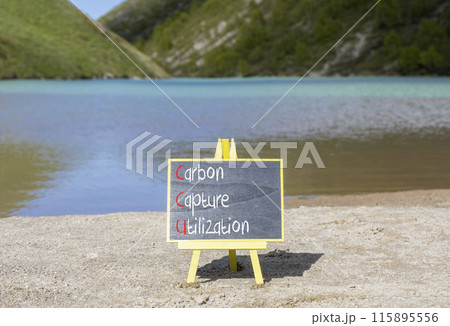 CCU Carbon capture utilization symbol Concept words CCU Carbon capture utilization on beautiful blackboard Beautiful lake background Business ecological Carbon capture utilization concept Copy space 115895556