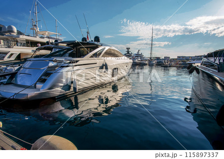 Awe Morning view on boats and yachts (sailboats) in Hercule port and buildings of Monaco Awe Morning view on boats and yachts (sailboats) in Hercule port and buildings of Monaco 115897337