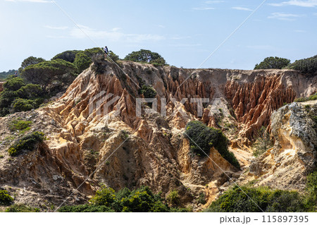 Praia da Marinha Beach among rock islets and cliffs seen from Seven Hanging Valleys Trail, Algarve, Portugal Praia da Marinha Beach among rock islets and cliffs seen from Seven Hanging Valleys Trail, Algarve, Portugal 115897395