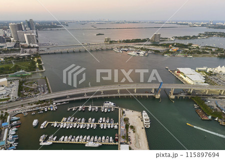 Luxury yachts docked in Biscayne Bay harbor in downtown district of Miami city in Florida, USA 115897694