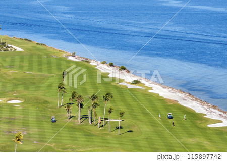 Big golf course field with green grass in Boca Grande, small town on Gasparilla Island in southwest Florida Big golf course field with green grass in Boca Grande, small town on Gasparilla Island in southwest Florida 115897742