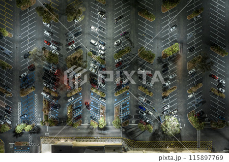 Top view of many cars parked on a parking lot in front of a shopping mall in Florida. Concept of urban transportation Top view of many cars parked on a parking lot in front of a shopping mall in Florida. Concept of urban transportation 115897769
