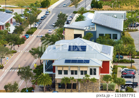 Solar rooftops in commercial center in Florida sustainable town. Photovoltaic panels for producing of clean ecological electrical energy in city area. Concept of autonomous building 115897791
