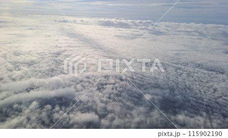 Expansive Aerial View of Fluffy Clouds Expansive Aerial View of Fluffy Clouds 115902190