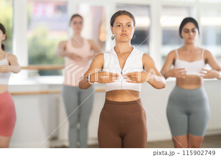 Young ballerinas rehearse ballet poses during ballet classes Young ballerinas rehearse ballet poses during ballet classes 115902749