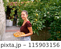 Girl in the garden with onion tarte tatin on a plate. High quality photo 115903156