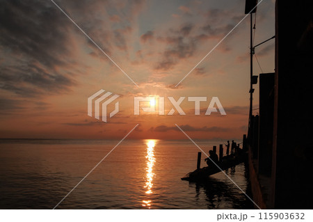 sunrise on the beach pier bridge with a clear sky sunrise on the beach pier bridge with a clear sky 115903632