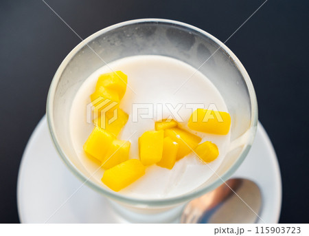 Mango mousse served in bowl for dessert 115903723
