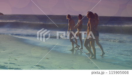 Image of glowing lights over group of diverse female friends by the sea 115905008