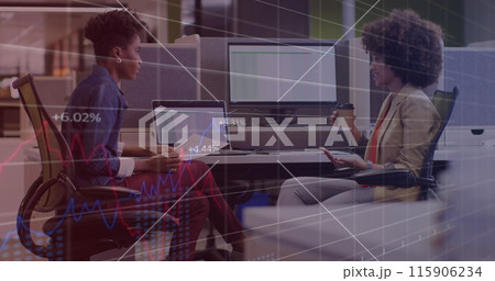 Image of statistical data processing against two diverse women discussing at office Image of statistical data processing against two diverse women discussing at office 115906234