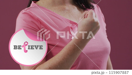 Image of believe text over caucasian woman with pink ribbon on pink background 115907887