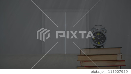 Image of alarm clock on books over table and light streaming through window 115907939