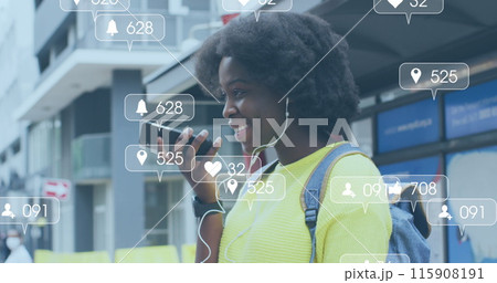 Image of social media icons over african american woman using smartphone 115908191