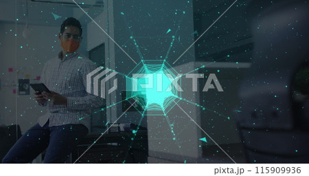 Globe of network of connections against man wearing face mask using digital tablet at office 115909936