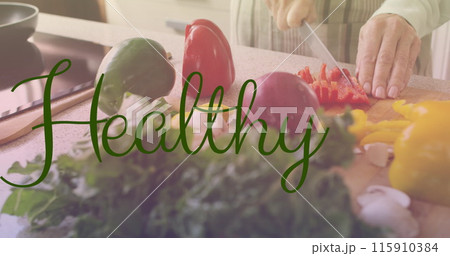 Image of healthy text in green letters over caucasian woman cutting vegetables 115910384