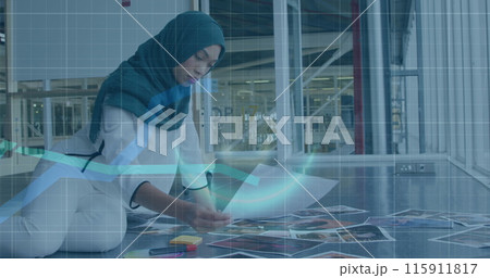 Image of financial data processing over biracial businesswoman working at office 115911817