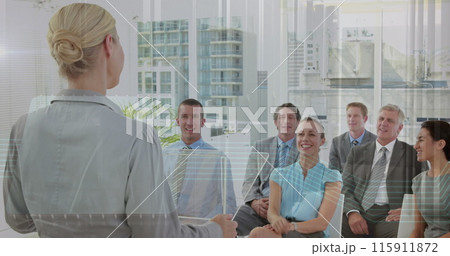 A businesswoman asks a question during a conference A businesswoman asks a question during a conference 115911872