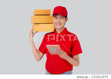 Young asian man carrying box and looking document on digital tablet isolated. 115912475