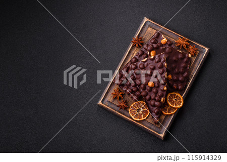 Black bitter chocolate with whole hazelnuts, candied fruits and mint 115914329