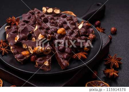 Black bitter chocolate with whole hazelnuts, candied fruits and mint Black bitter chocolate with whole hazelnuts, candied fruits and mint 115914378